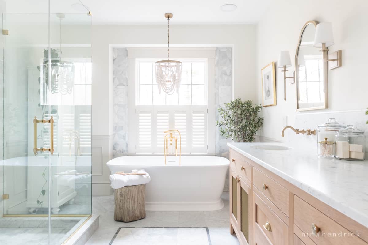 Bright bathroom remodel with glass shower, dual vanity, and natural light